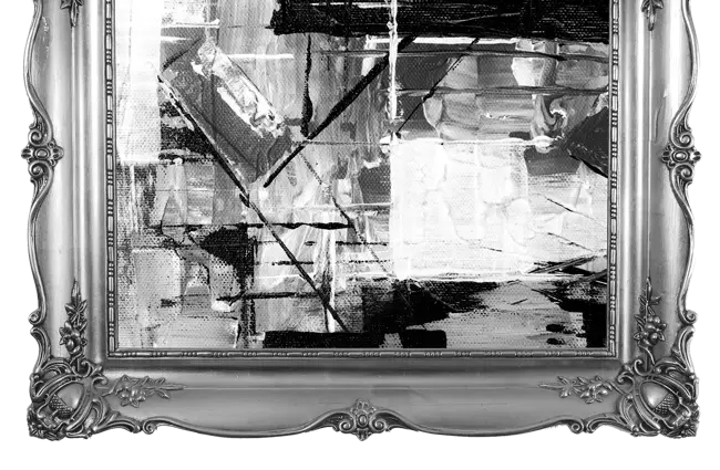 Abstract black and white artwork in an ornate silver frame