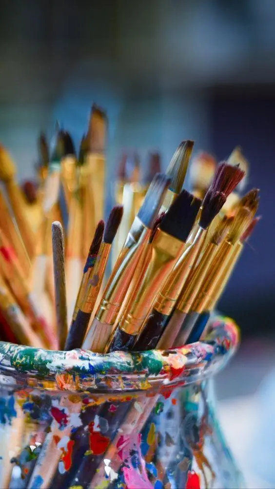 Paintbrushes in a jar in Lana Almouakeh's painting studio